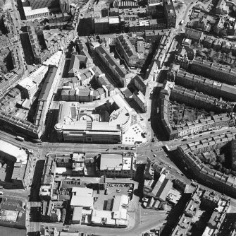 Oblique aerial view centred on the bank, shop and offices, taken from the WSW.