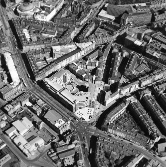 Oblique aerial view centred on the bank, shop and offices, taken from the S.