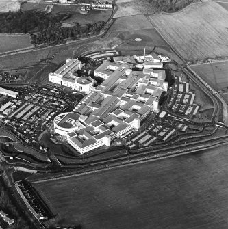 Oblique aerial view centred on the hospital, taken from the SE.