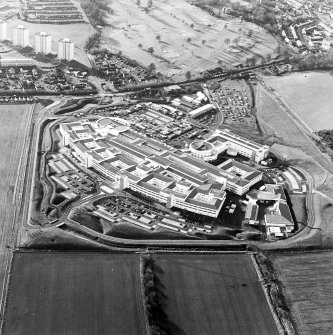 Oblique aerial view centred on the hospital, taken from the ENE.