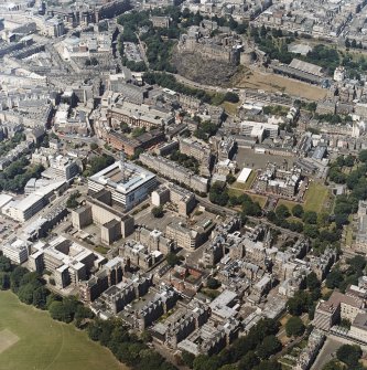 Oblique aerial view centred on the hospital with the chapel, hospital and school adjacent, taken from the SE.