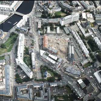 Oblique aerial view centred on the excavation of the Black Vaults, Edinburgh, with the warehouses and offices adjacent, taken from the SW.