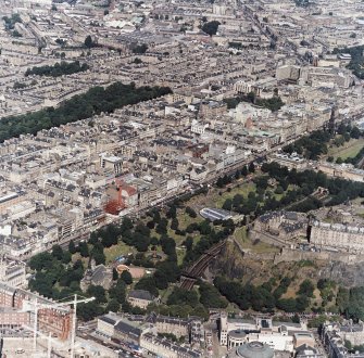Oblique aerial view, taken from the SSW, showing the New Town in the centre of the photograph, and centred on Princes Street and Princes Street Gardens.
