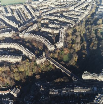 Oblique aerial view of Stockbridge centred on the church and bridge, taken from the SSW.