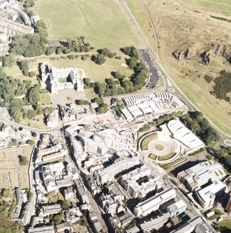 Oblique aerial view centred on the construction of the Scottish Parliament with the exhibition centre and palace adjacent, taken from the W.