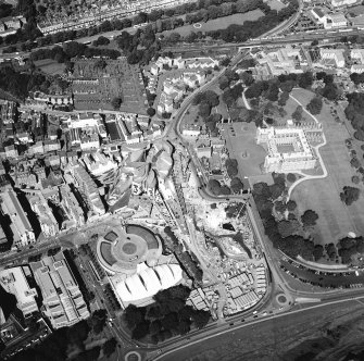 Oblique aerial view centred on the Scottish parliament building with `Our Dynamic Earth¿ and Holyrood palace adjacent, taken from the S.