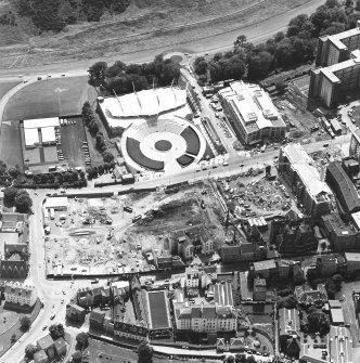 Oblique aerial view centred on the Scottish parliament building under contruction with Qeensberry House and 'Our Dynamic Earth' adjacent, taken from the NNE.