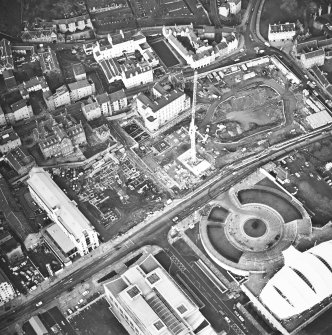 Oblique aerial view centred on the Scottish parliament under construction with `Our Dynamic Earth¿ adjacent, taken from the S.