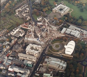 Oblique aerial view centred on the construction of the parliament building with the conference centre, exhibition centre and palace adjacent, taken from the SW.