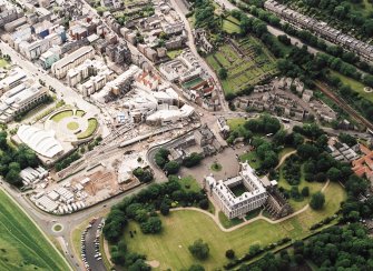 Oblique aerial view centred on the construction of the Scottish Parliament with the exhibition centre and palace adjacent, taken from the ESE.