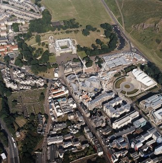 Oblique aerial view centred on the construction of the Scottish Parliament with the exhibition centre and palace adjacent, taken from the W.