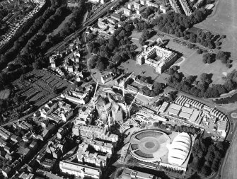 Oblique aerial view centred on the construction of the Scottish Parliament with the exhibition centre and palace adjacent, taken from the SW.