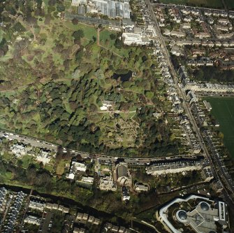 Oblique aerial view of the botanical garden centred on the Herbarium, hall and gate-lodge, taken from the SSE.