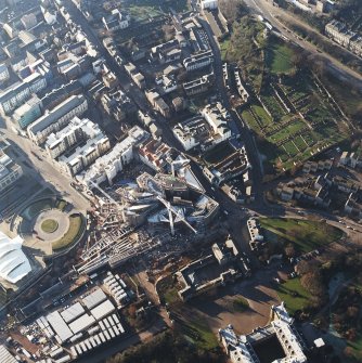 Oblique aerial view centred on the construction of the Scottish parliament, taken from the E.