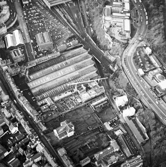 Oblique aerial view centred on the development of Tolbooth Wynd with the church and graveyard adjacent, taken from the E.