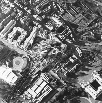 Oblique aerial view centred on the construction of the Scottish parliament, taken from the SE.