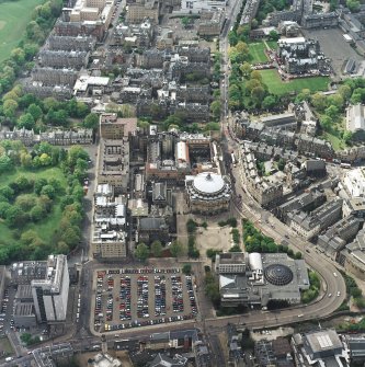 Oblique aerial view centred on the hall with school, university, club, chapel, hospital and school adjacent, taken from the ENE.