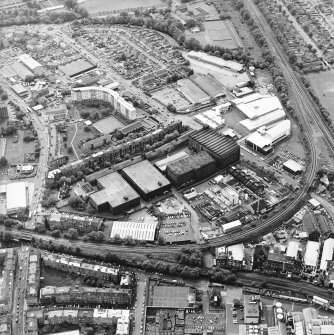 Oblique aerial view centred on the bonded warehouse with the pumphouse and pavilion adjacent, taken from the ENE.