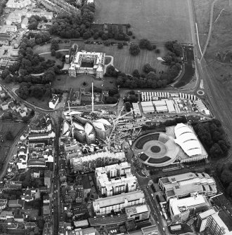 Oblique aerial view centred on the construction of the Scottish Parliament with the exhibition centre and palace adjacent, taken from the WSW.