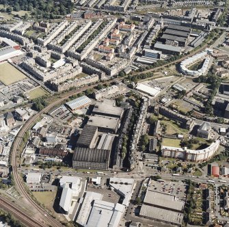 Oblique aerial view centred on the bonded warehouse with the park and bowling green adjacent, taken from the NW.