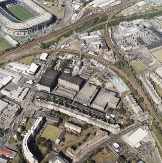 Oblique aerial view centred on the bonded warehouse with the park and bowling green adjacent, taken from the SSW.