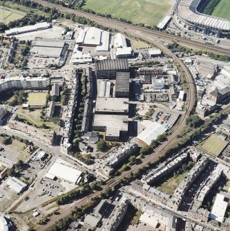 Oblique aerial view centred on the bonded warehouse with the park and bowling green adjacent, taken from the SE.