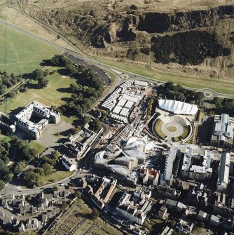 Oblique aerial view centred on the construction of the parliament, taken from the NW.