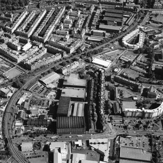 Oblique aerial view centred on the bonded warehouse with the park and bowling green adjacent, taken from the WNW.