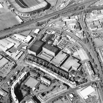 Oblique aerial view centred on the bonded warehouse with the park and bowling green adjacent, taken from the SSW.