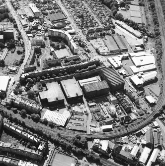 Oblique aerial view centred on the bonded warehouse with the park and bowling green adjacent, taken from the ENE.