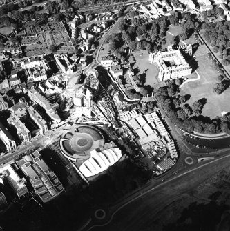 Oblique aerial view centred on the construction of the Scottish Parliament with the exhibition centre and palace adjacent, taken from the SSW.