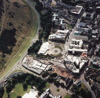 Oblique aerial view centred on the construction of the Scottish Parliament with Our Dynamic Earth and Queensbury House adjacent, taken from the ENE.