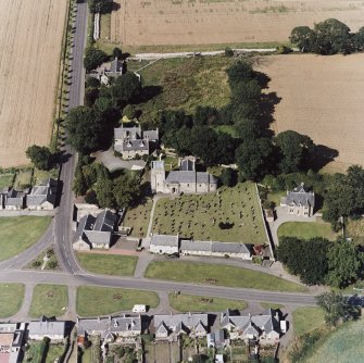 Dalmeny village and Dalmeny Parish Church, oblique aerial view.