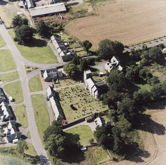 Dalmeny village and Dalmeny Parish Church, oblique aerial view.