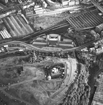 Edinburgh, oblique aerial view taken from the NE, centred on Calton Hill showing the city observatory, the National and Nelson Monument.  St Andrew's House is also visible.