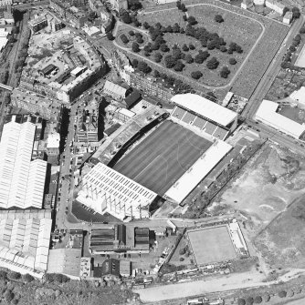 Oblique aerial view of Easter Road Stadium, Hibernian Football Club, taken from the SE, centered on the stadium.