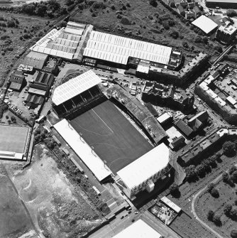 Oblique aerial view of Easter Road Stadium, Hibernian Football Club, taken from the N, centered on the stadium.