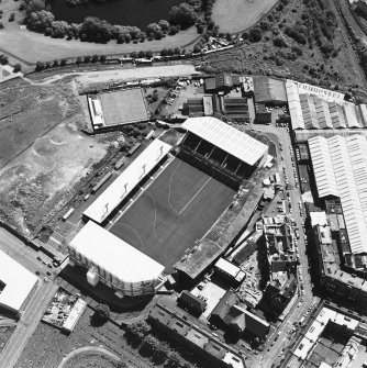 Oblique aerial view of Easter Road Stadium, Hibernian Football Club, taken from the NW, centered on the stadium.