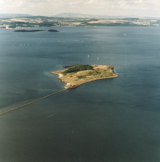 General oblique aerial view looking across Cramond Island towards Inchcolm Abbey and Aberdour, taken from the SE.