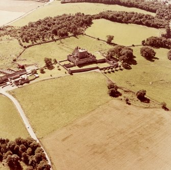 Oblique aerial view from North East of Craigmillar Castle and Mains