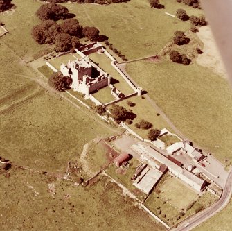 Oblique aerial view from East South East of Craigmillar Castle and Mains