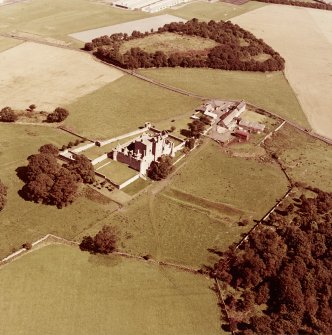 Oblique aerial view from South West of Craigmillar Castle and Mains