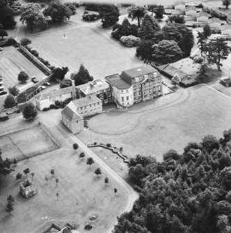Oblique aerial view from SE.