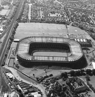 Edinburgh, Murrayfield Stadium, oblique aerial view, taken from the ENE, centred on Murrayfield Stadium. Murrayfield Ice Rink and Roseburn House are visible in the right half of the photograph.