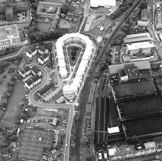 Oblique aerial view centred on Slateford Green with brewery adjacent, taken from the SE.