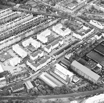 Oblique aerial view centred on Sinclair Place with bakery, factory and brewery adjacent, taken from the W.