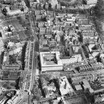 Oblique aerial view from West showing the Royal Infirmary and George Heriots Hospital School. Includes Chalmers Street.