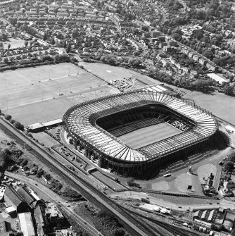 Edinburgh, Murrayfield Stadium, oblique aerial view, taken from the E, centred on Murrayfield Stadium. Murrayfield Ice Rink is visible in the top centre half of the photograph.