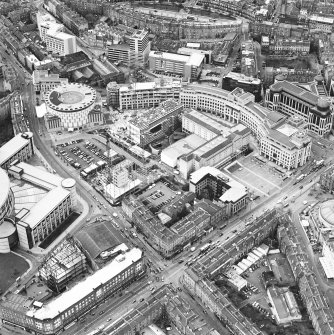 Oblique aerial view centred on the hotel, offices and conference centre, taken from the ESE.