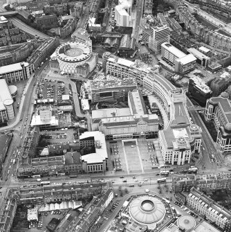 Oblique aerial view centred on the hotel, offices and conference centre, taken from the E.